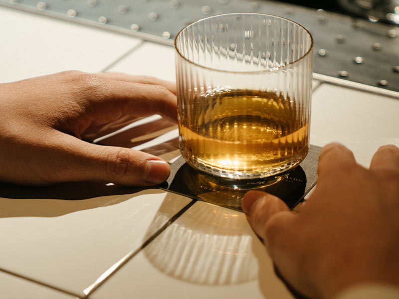 glass of liquor on a bar top
